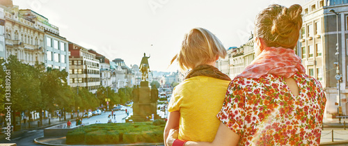 mother and daughter tourists exploring attractions in Prague photo