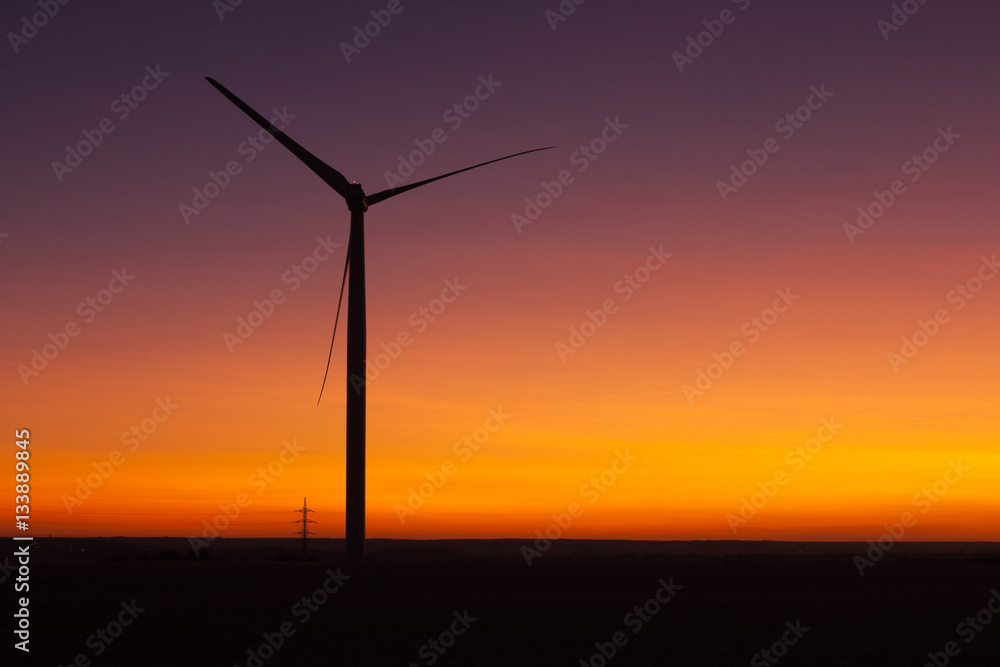Windfarm at sunset and sky with dust from volcano Windfarm at sunset and sky with dust from volcano