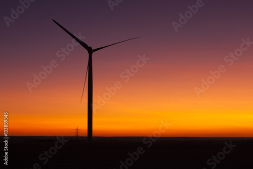 Windfarm at sunset and sky with dust from volcano