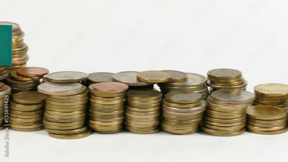 Guinea flag waving with stack of money coins Guinea flag waving with stack of money coins