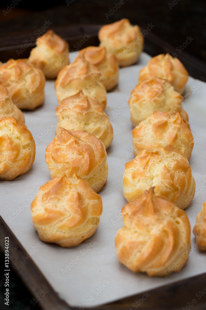 French dessert croquembouche. Wedding cake. New year dessert. Homemade eclairs filled with custard. Profiterole. French dessert croquembouche. Wedding cake. New year dessert. Homemade eclairs filled with custard. Profiterole.