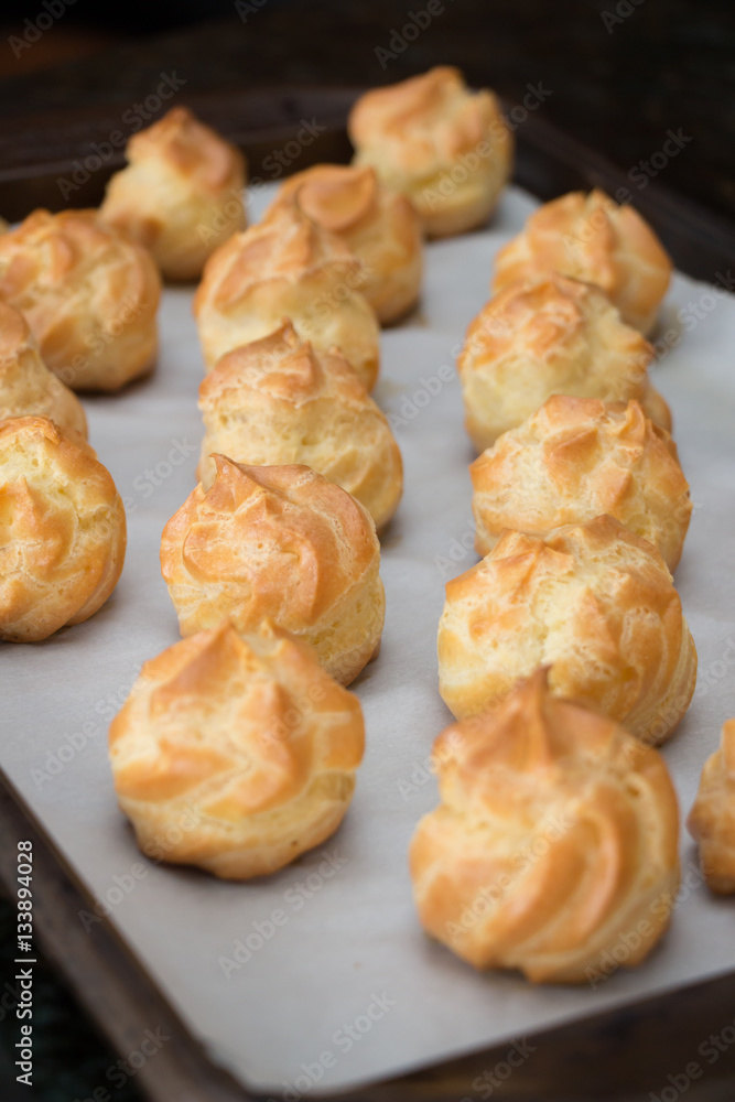 French dessert croquembouche. Wedding cake. New year dessert. Homemade eclairs filled with custard. Profiterole. 