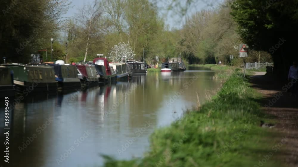long boats on a canal in England long boats on a canal in England