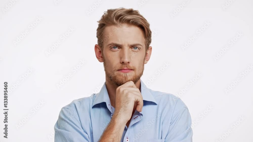 Unapproving Caucasian male with brown beard and blue eyes on white background Unapproving Caucasian male with brown beard and blue eyes on white background
