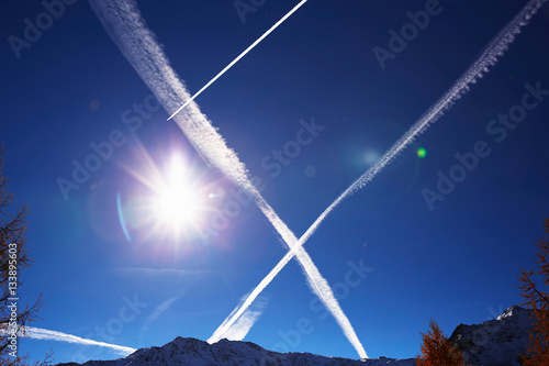 Steam trails in sky, Schluderns, South Tyrol, Italy photo