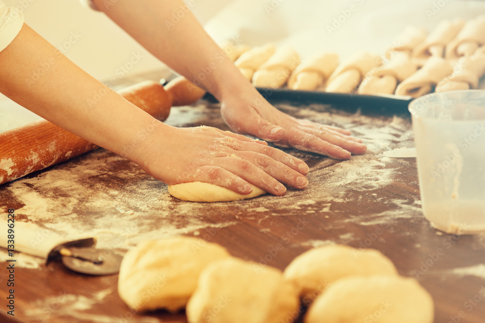 Woman Working With Dough, Making Croissants. Close up.
