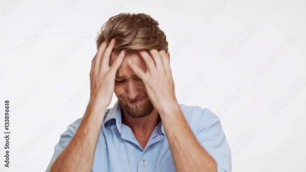 Disappointed Caucasian male with blue eyes and brown beard asking why on white background Disappointed Caucasian male with blue eyes and brown beard asking why on white background