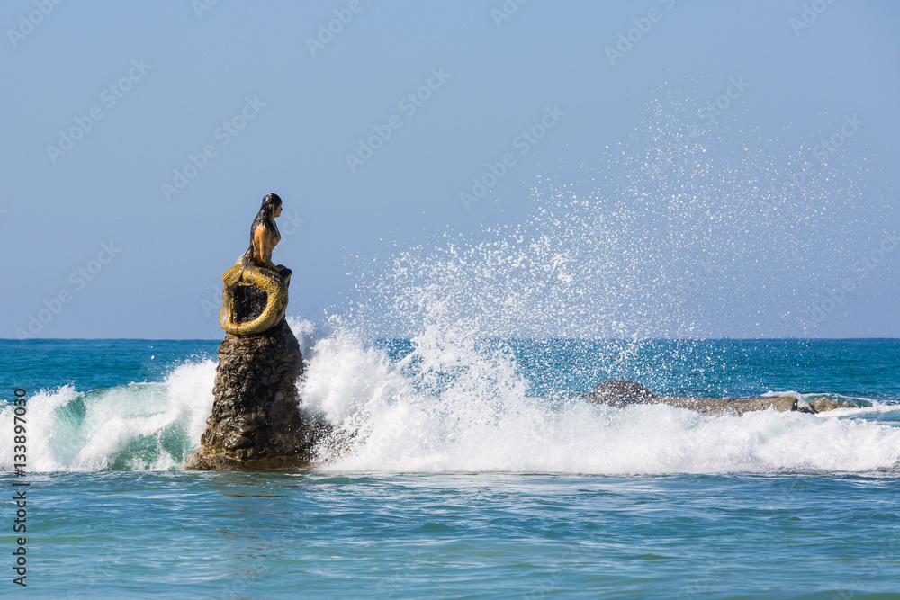 mermaid statue of Ngapali Beach near Thandwe at Rakhine state in Myanmar mermaid statue of Ngapali Beach near Thandwe at Rakhine state in Myanmar