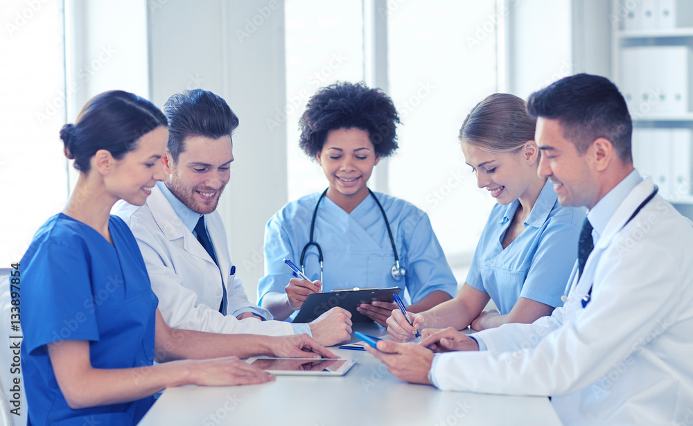 group of happy doctors meeting at hospital office group of happy doctors meeting at hospital office