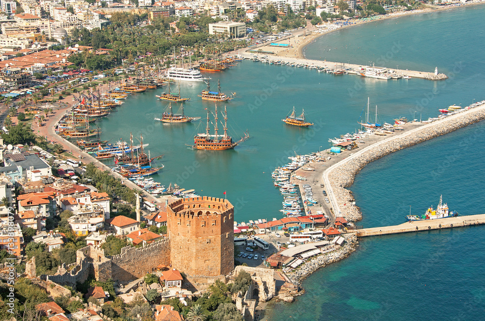 Majestic aerial view of Alanya harbor with Kizil Kule tower in Alanya city, Turkey.