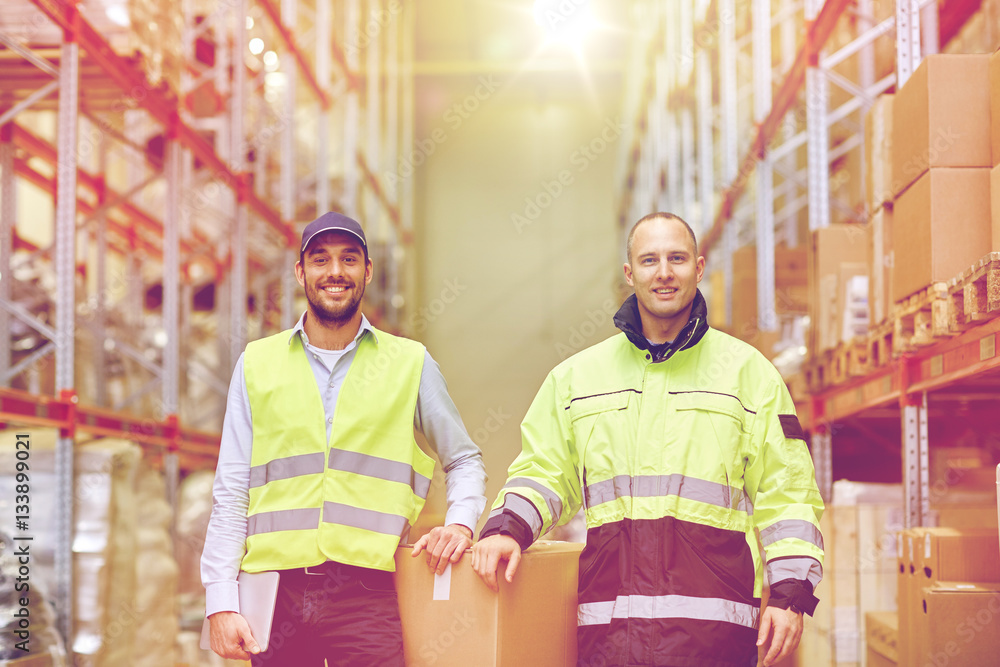 men in uniform with boxes at warehouse men in uniform with boxes at warehouse