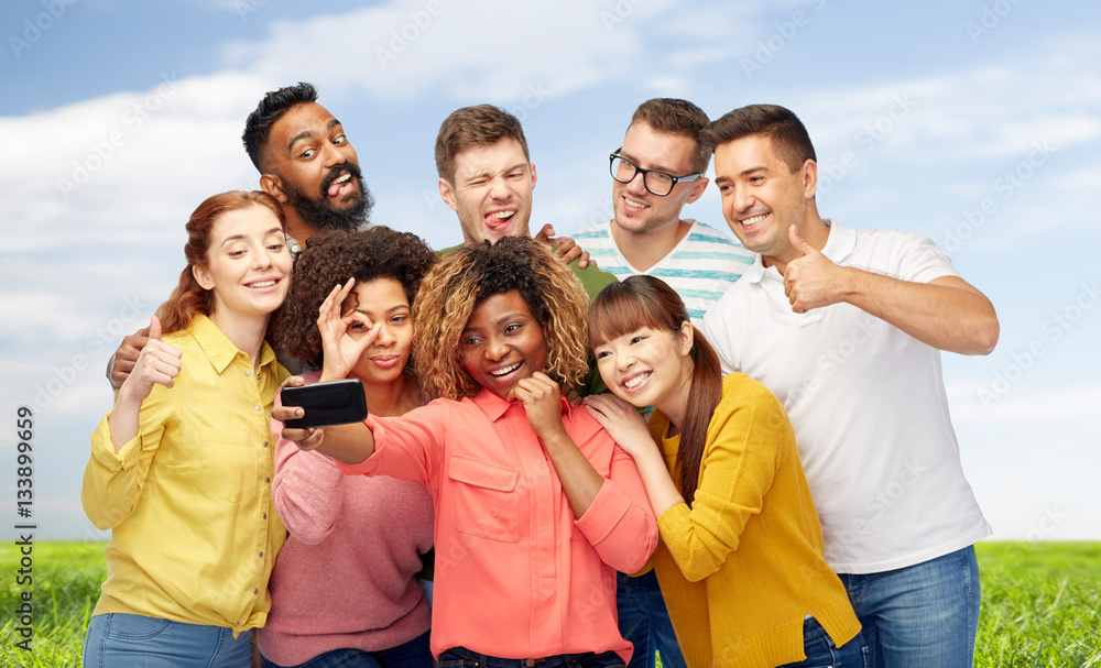 group of people taking selfie by smartphone group of people taking selfie by smartphone