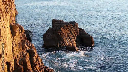 View of waves splashing on rocks in the Ligurian Sea of Cinque Terre Italy
