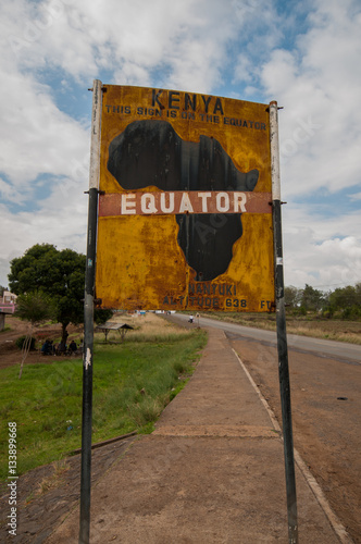 Sign marking the equator line dividing north and south hemispheres, Nanyuku, Kenya photo