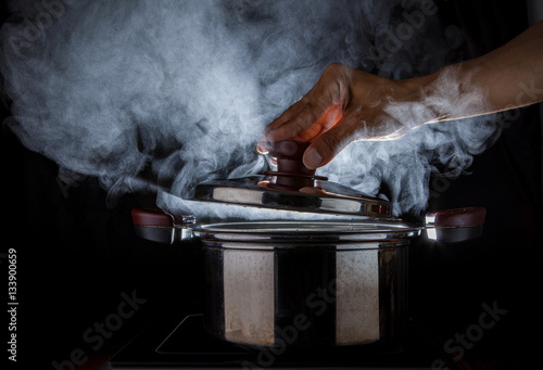 hand open hot steam pot photo