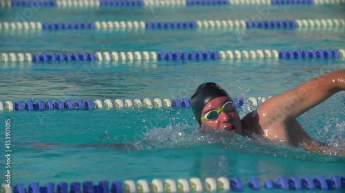 Swimmer doing crawl in race lane