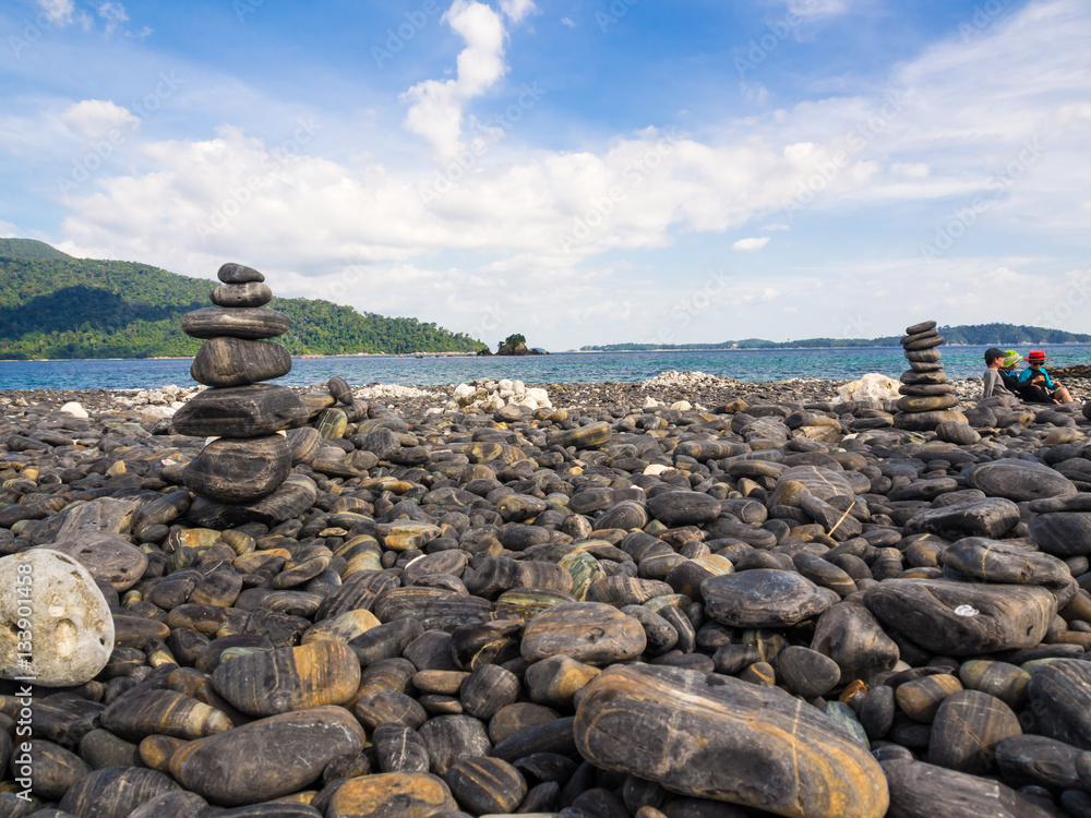 Balance stone on sea beach mountain background Balance stone on sea beach mountain background