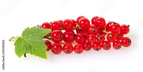 Red currant with green leaves isolated on white background