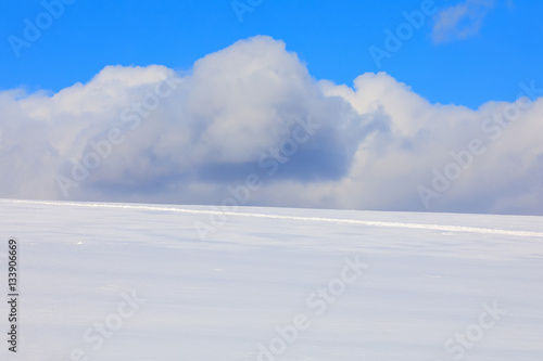 Simple winter background with blue sky