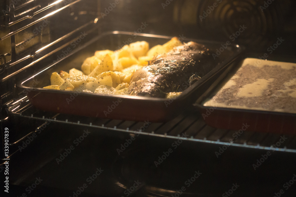 Potatoes baking in toaster oven Stock Photo Adobe Stock