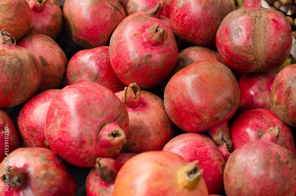 Group of pomegranates. Pomegranate closeup, background Group of pomegranates. Pomegranate closeup, background
