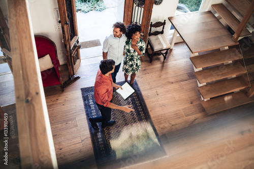 Agent showing home to buyers