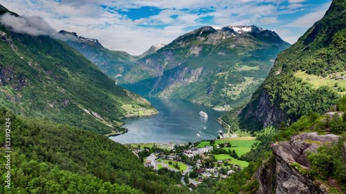 Timelapse, Geiranger fjord, Norway - 4K ULTRA HD, 4096x2304. It is a 15-kilometre (9.3 mi) long branch off of the Sunnylvsfjorden, which is a branch off of the Storfjorden (Great Fjord). photo