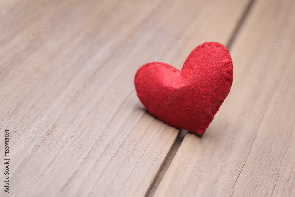 Valentines day concept of one heart shape decoration with old wood floor background. Valentines day concept of one heart shape decoration with old wood floor background.
