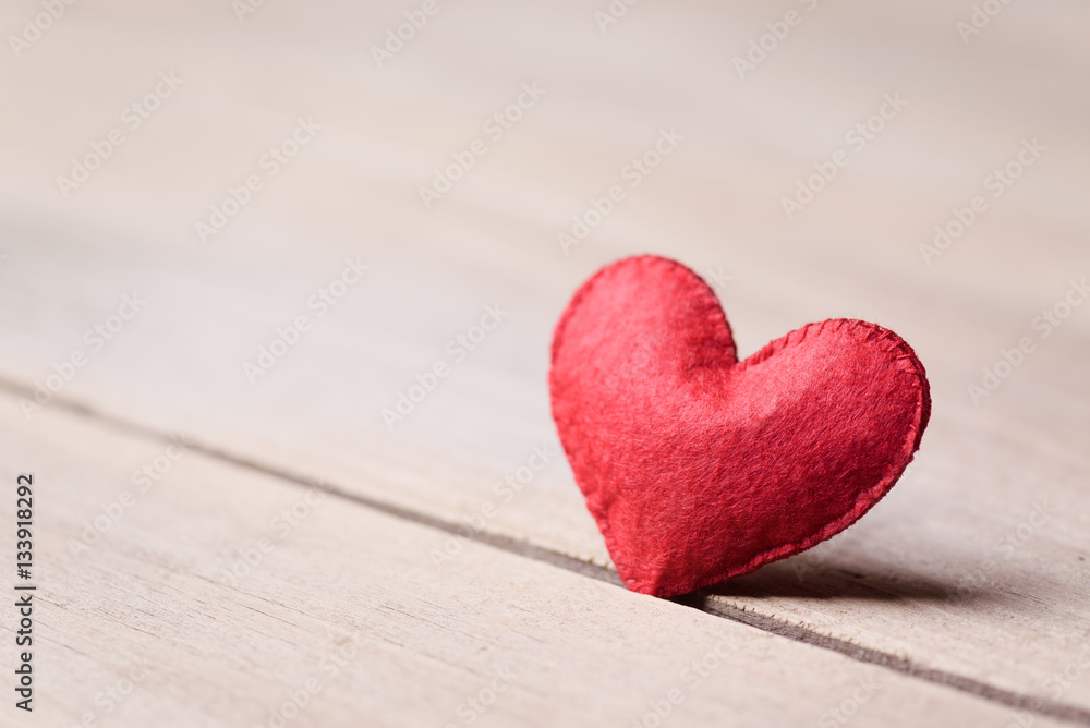 Valentines day concept of one heart shape decoration with old wood floor background. Valentines day concept of one heart shape decoration with old wood floor background.
