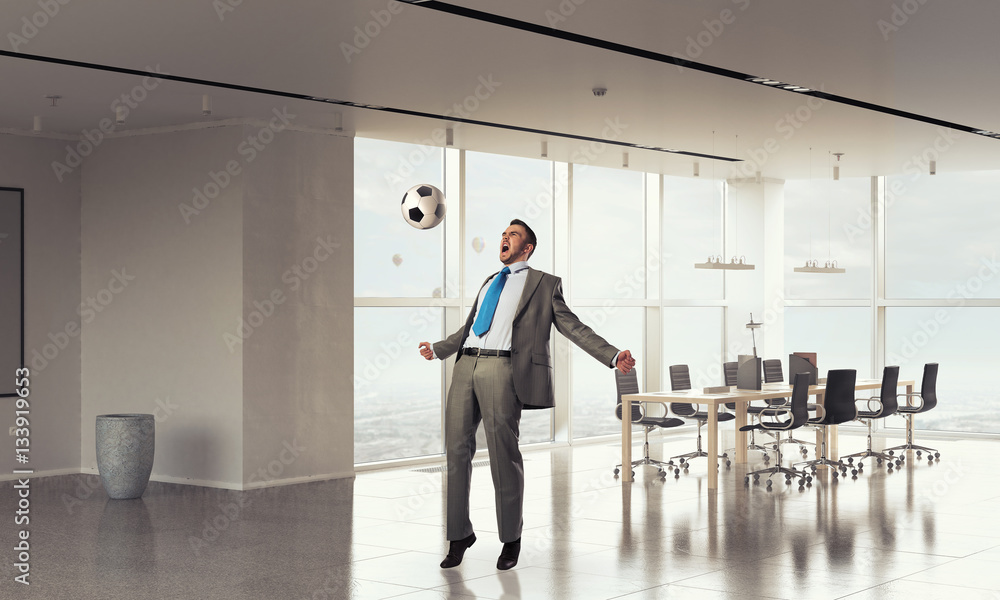 Fototapeta premium He is football fan . Mixed media