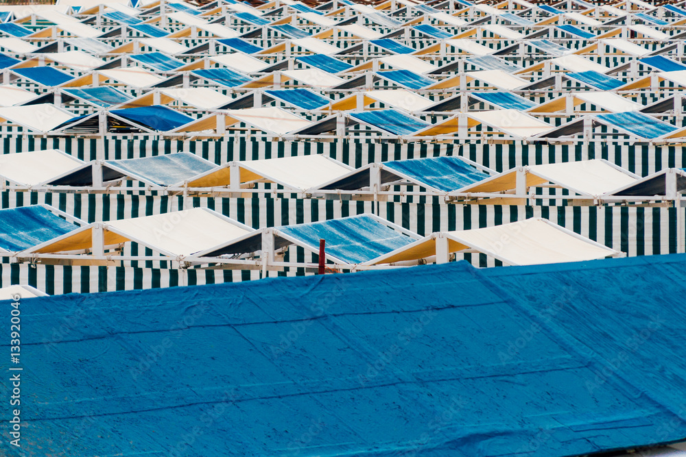 Empty tents in a seaside resort on a beach in Mar del Plata, Arg Empty tents in a seaside resort on a beach in Mar del Plata, Arg