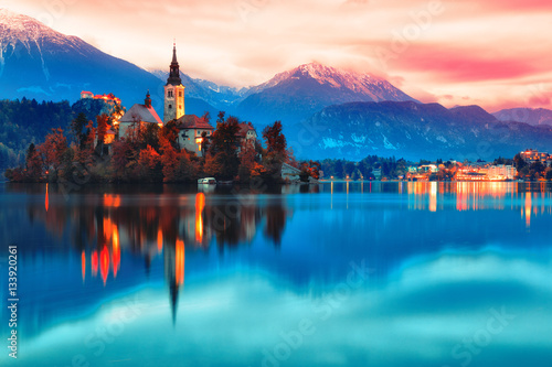 Night scene of Bled lake in Slovenia, famous and popular travel destination for romantic couple in love. Artistic toning landscape. photo