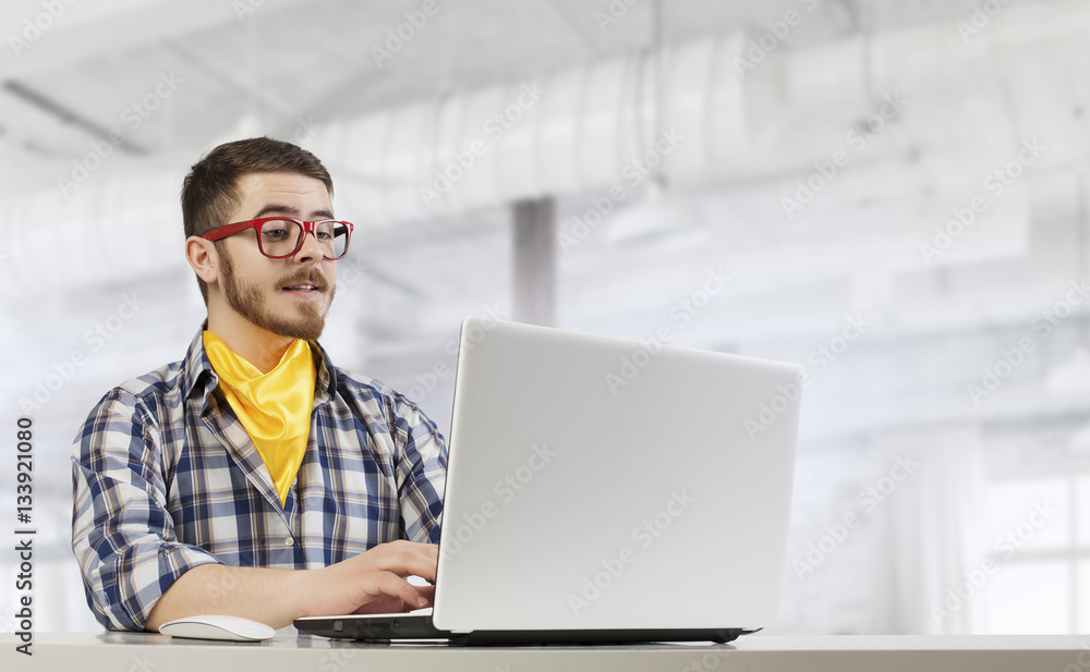 Hipster guy use laptop . Mixed media Hipster guy use laptop . Mixed media