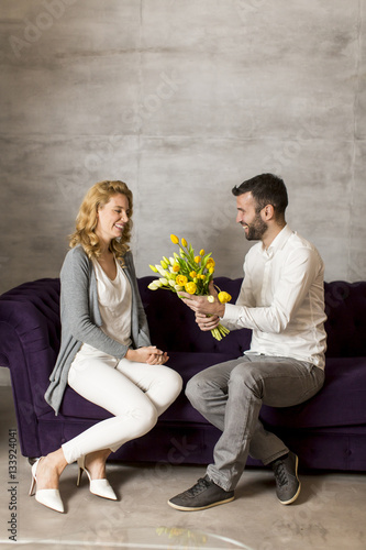 Loving couple with bouquet ...