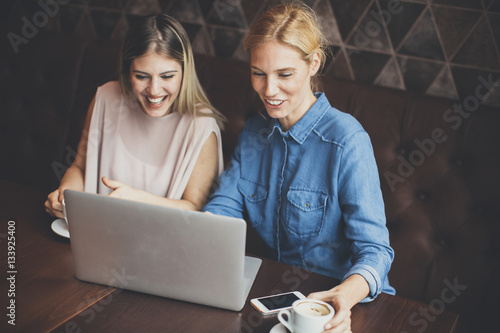 Young women with laptop in ...
