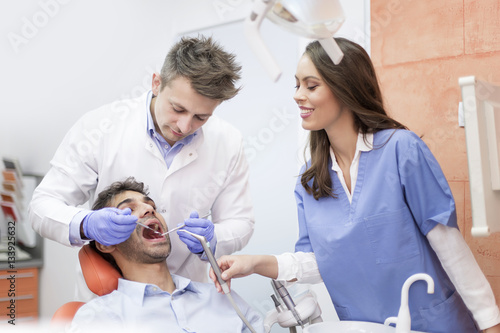 Young man having dental che...