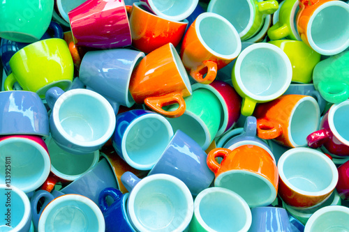 Heap of colorful cups for espresso coffee - concept of coffee ad