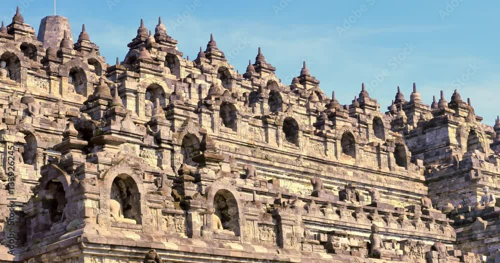 Tourists visiting famous ancient Buddhist Borobudur temple in Java Indonesia Tourists visiting famous ancient Buddhist Borobudur temple in Java Indonesia