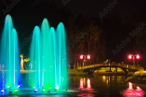 Fountain with backlight on the pond