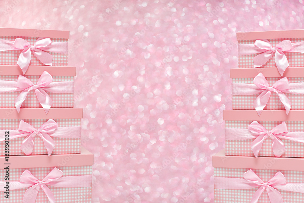 gift boxes with satin ribbons on bokeh background. gift boxes with satin ribbons on bokeh background.