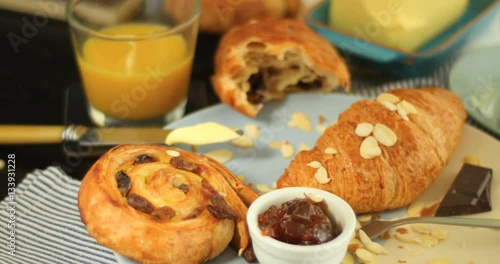 Wallpaper Mural Dolly push in view of a French breakfast with pastries, orange juice and coffee Torontodigital.ca