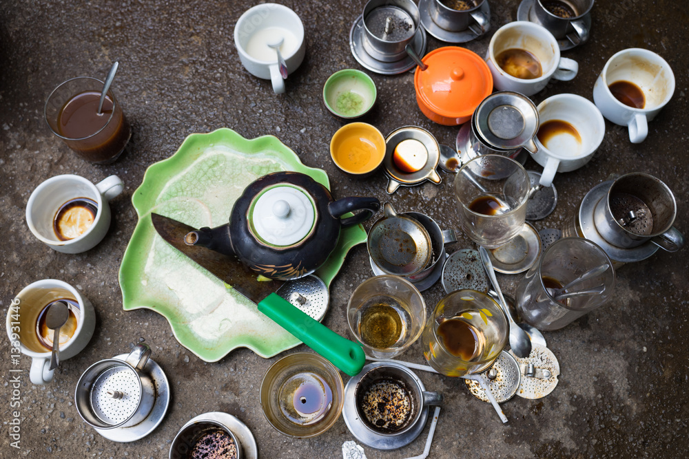 Messy unwashed coffee cups on floor Messy unwashed coffee cups on floor