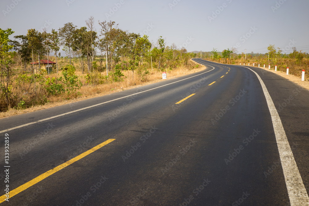 Infinity curved road with yellow line. Concept of adventure, travel, success...