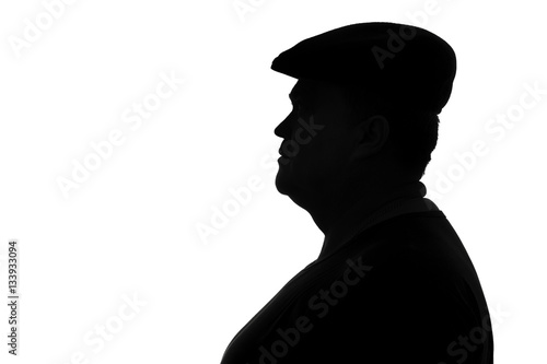 silhouette of a plump man in a cap