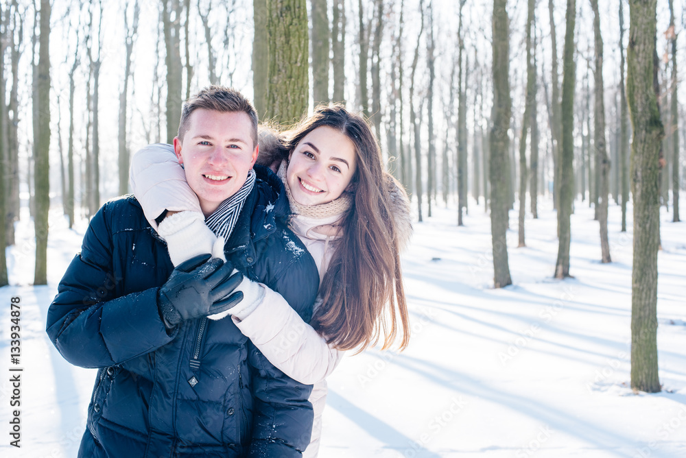 young loving couple having fun in snowy park
young loving couple having fun in snowy park