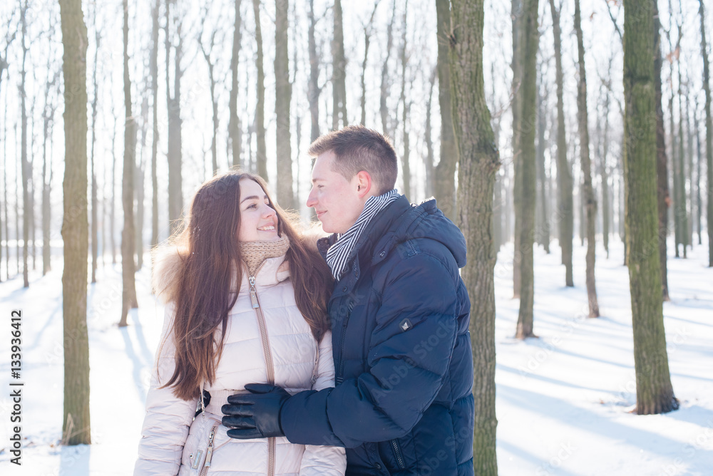 young loving couple having fun in snowy park
young loving couple having fun in snowy park