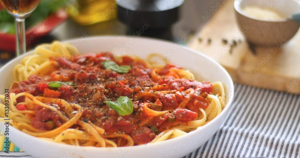 Dolly sliding view of Italian pasta (spaghetti, linguini) with tomato sauce Dolly sliding view of Italian pasta (spaghetti, linguini) with tomato sauce