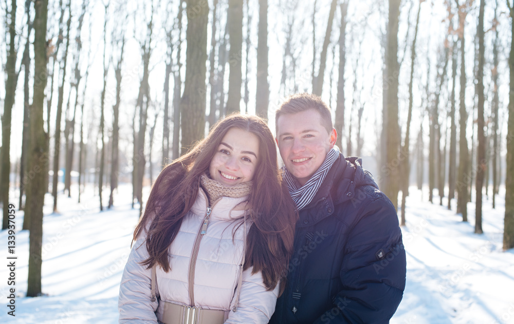 young loving couple having fun in snowy park
young loving couple having fun in snowy park