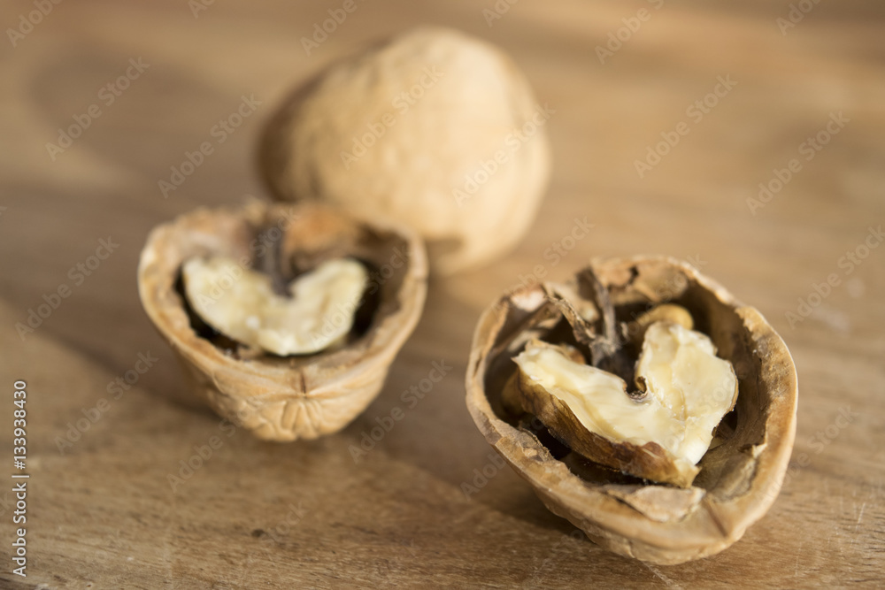 wlanuts cut in half on a wooden table wlanuts cut in half on a wooden table