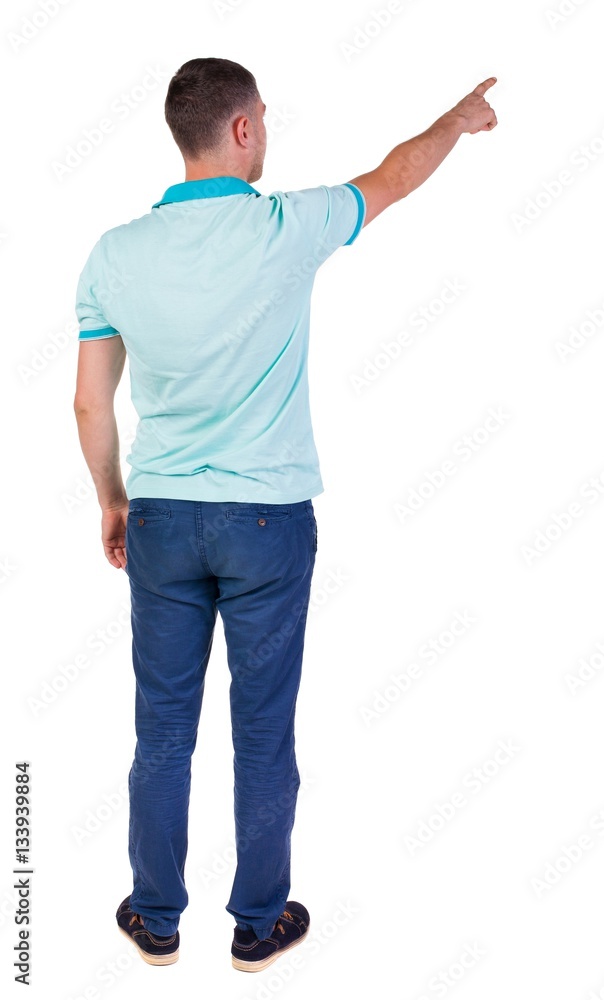 Back view of pointing young men in shirt and jeans. Back view of pointing young men in shirt and jeans.